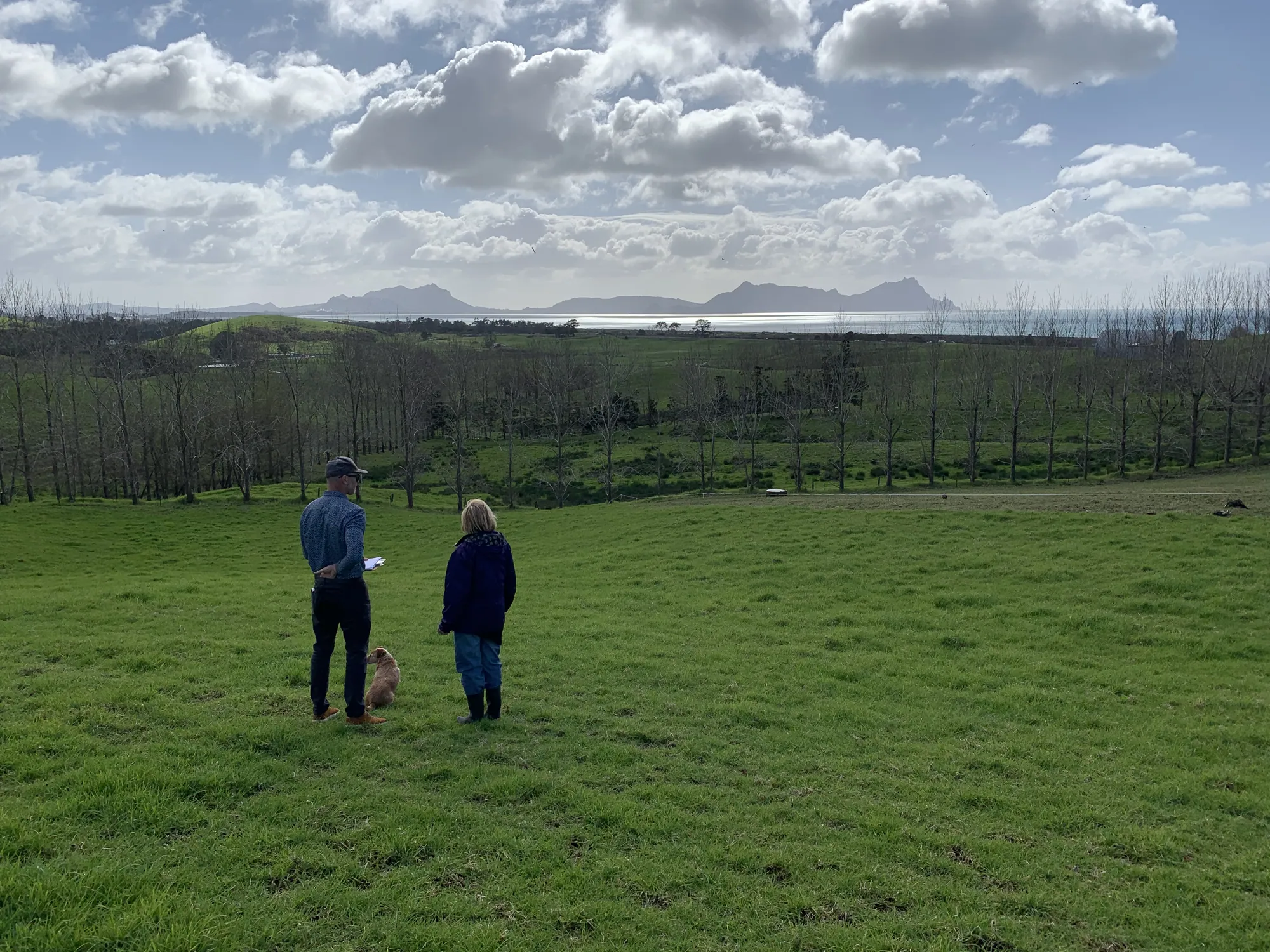 Craig on a bare coastal section with a client's architect, early in the design stage