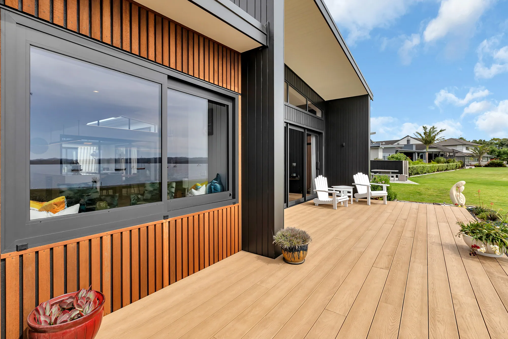 Cedar-clad home with a north-facing deck, one of 28 plans in the collection