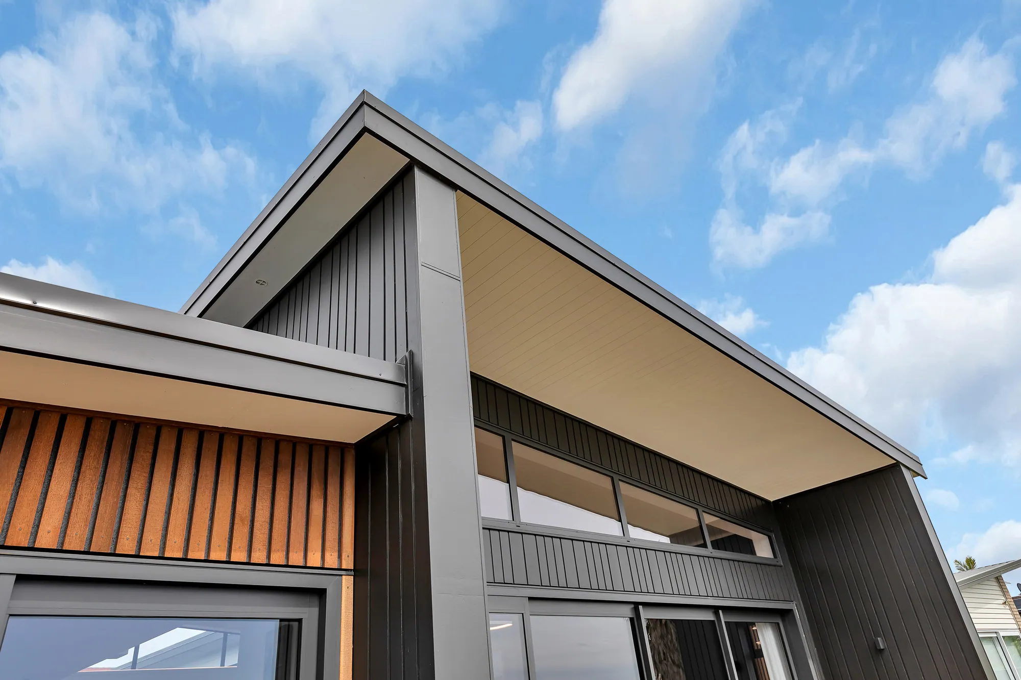 Architecturally designed home in cedar and dark cladding
