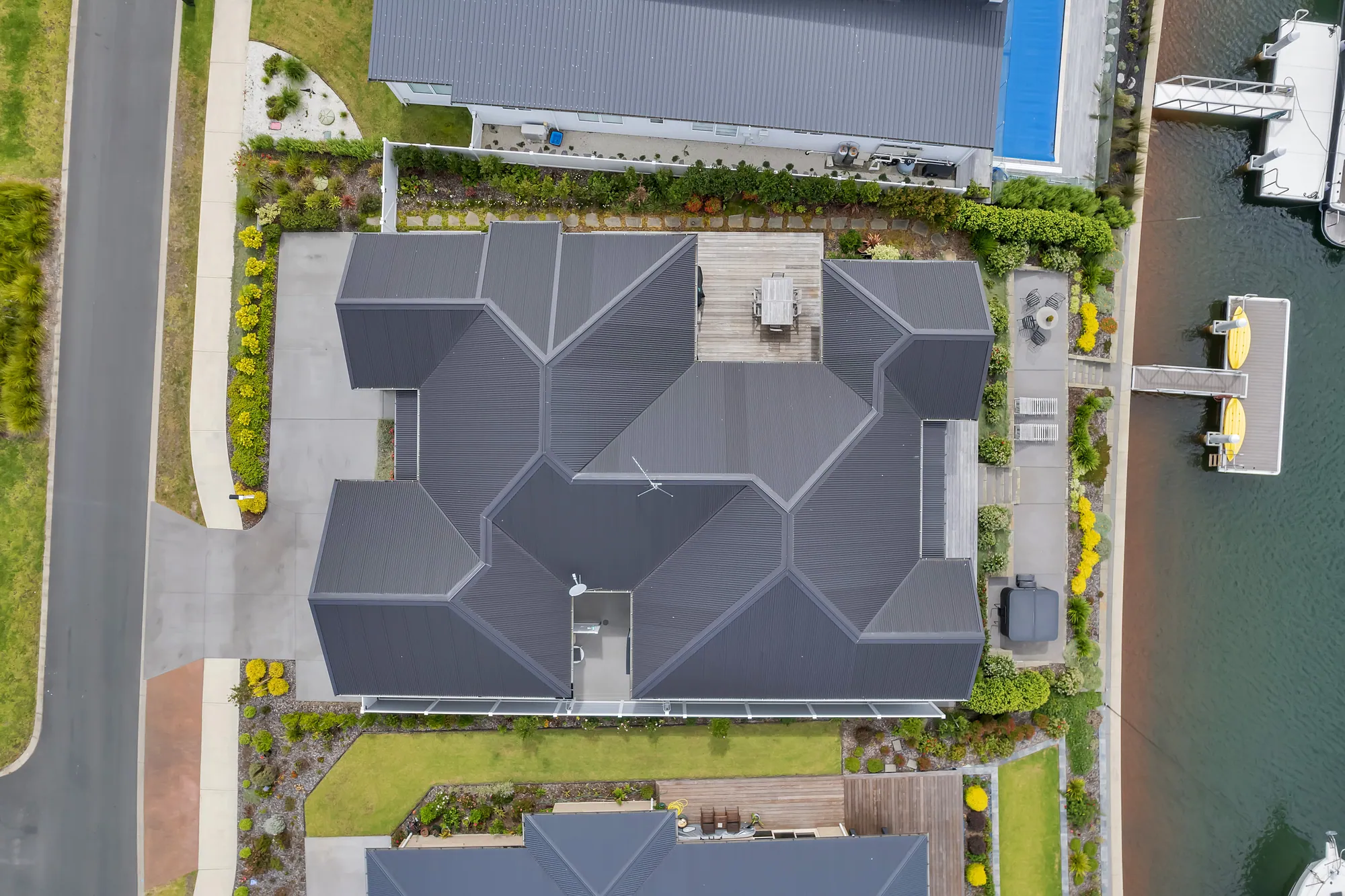 Private berth and canal frontage at a Marsden Cove home, seen from above