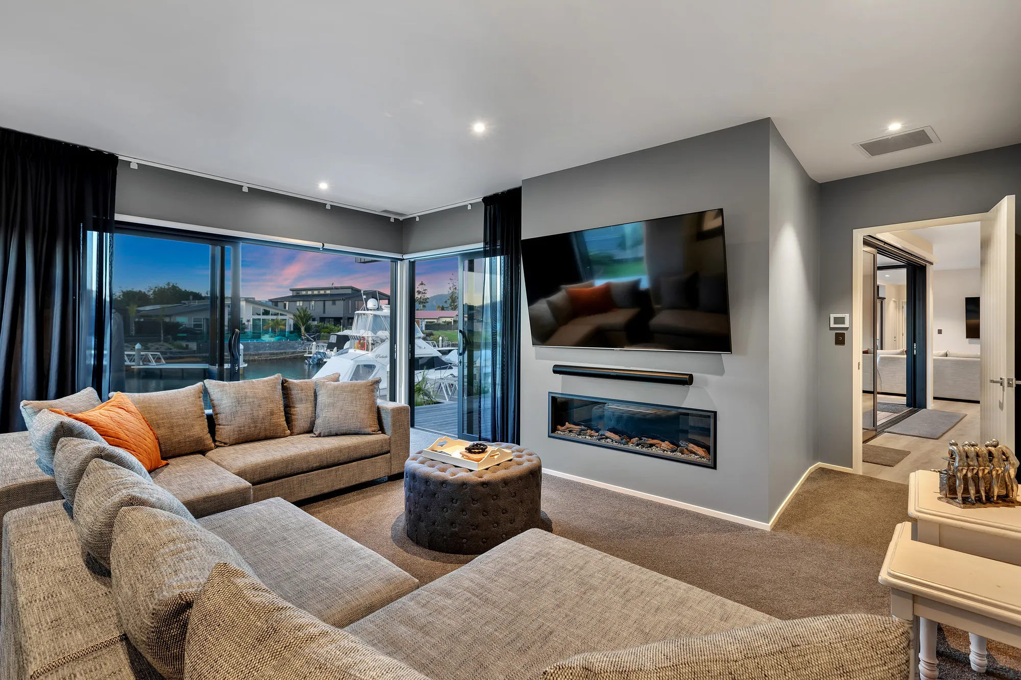 Interior living space of a canal home, opening to the deck
