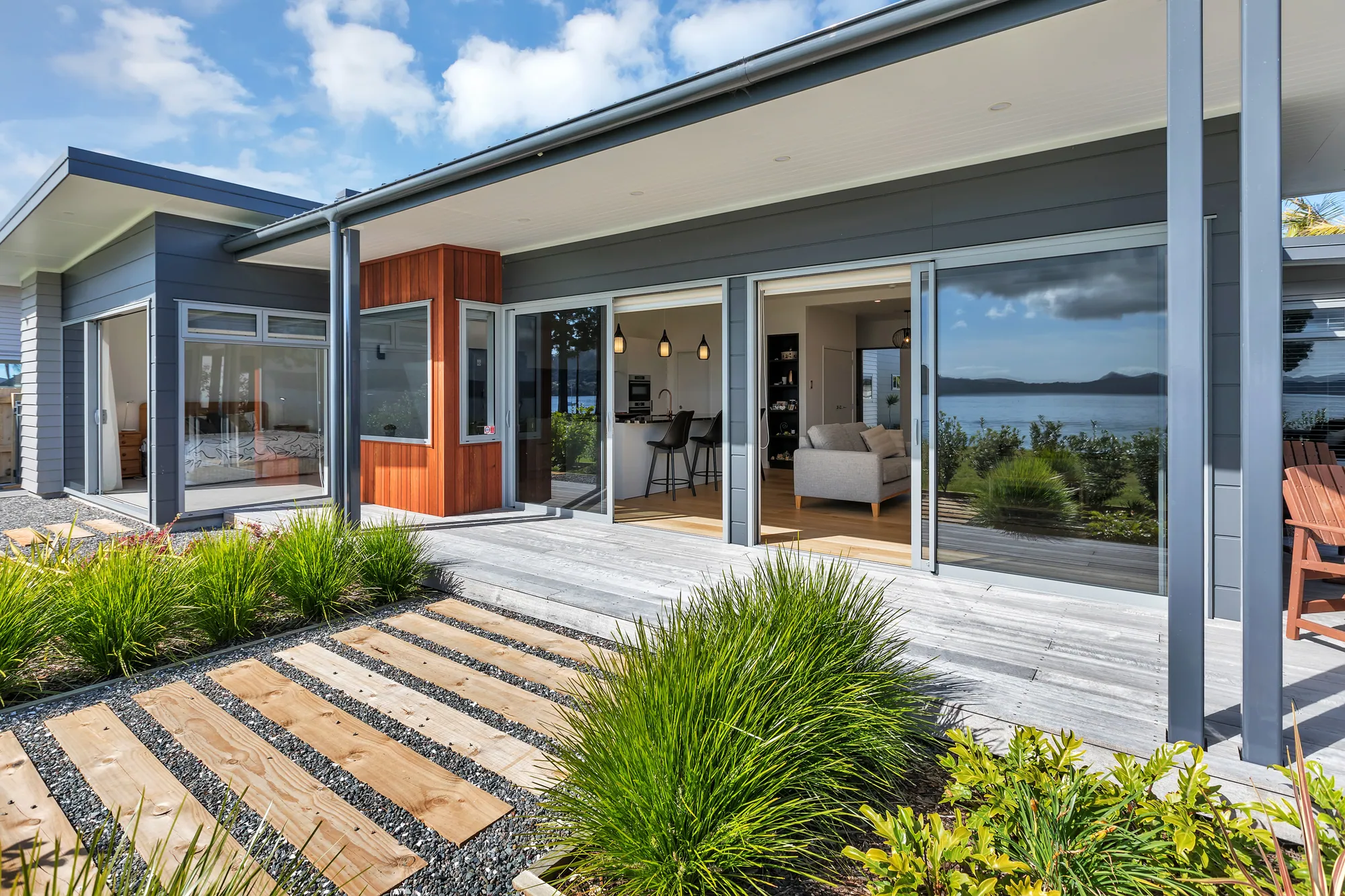 Covered deck and glass sliders along the water side of a canal home