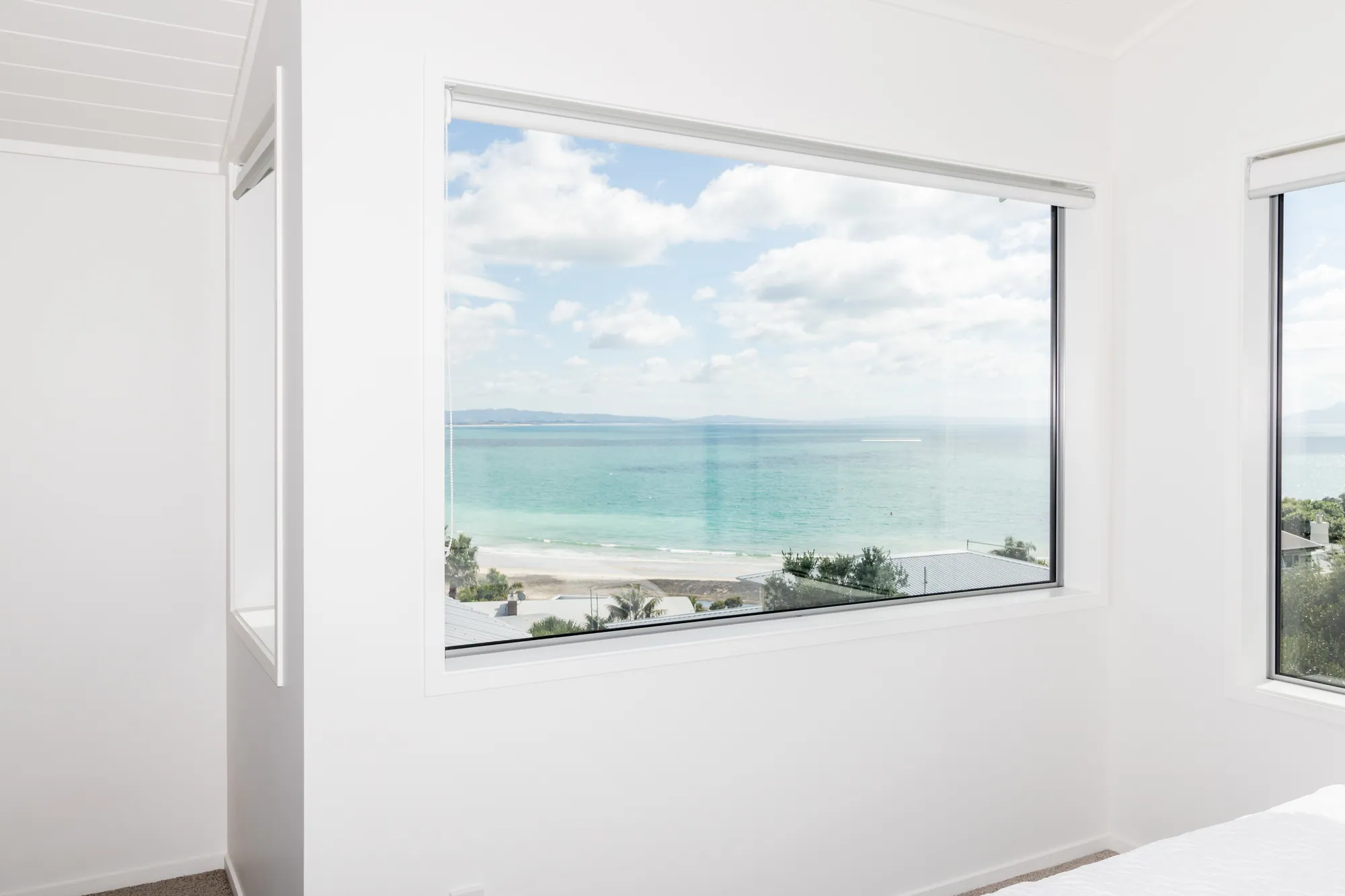 Renovated bedroom looking out over Langs Beach