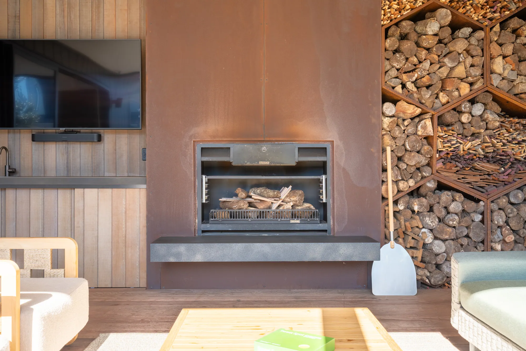 The showhome fireplace and stacked-timber wall