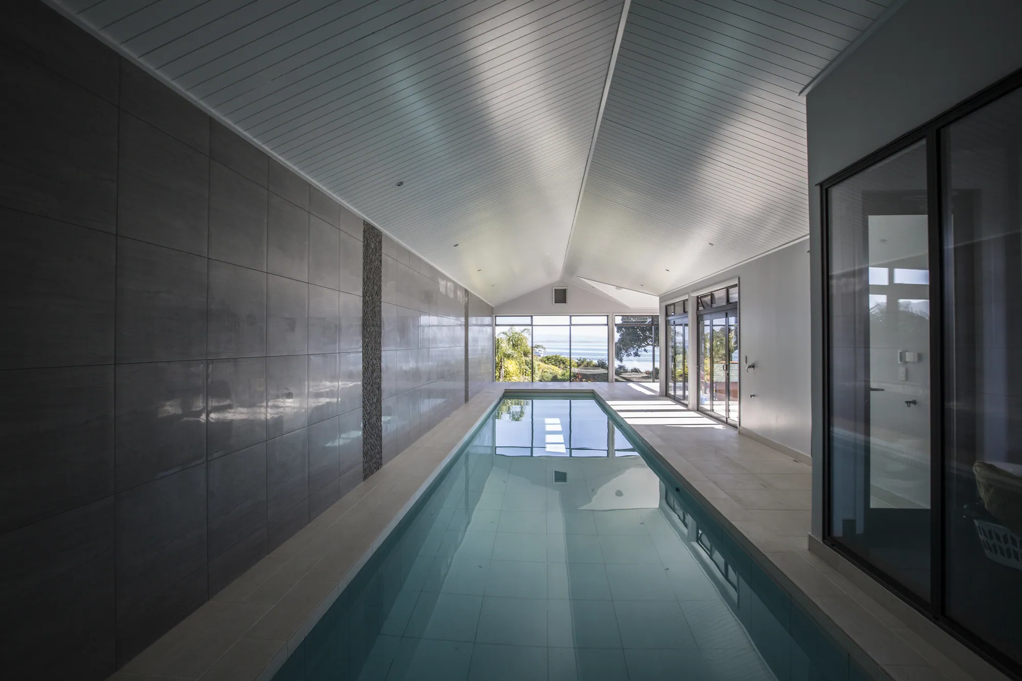 Indoor lap pool built as part of a One Tree Point home