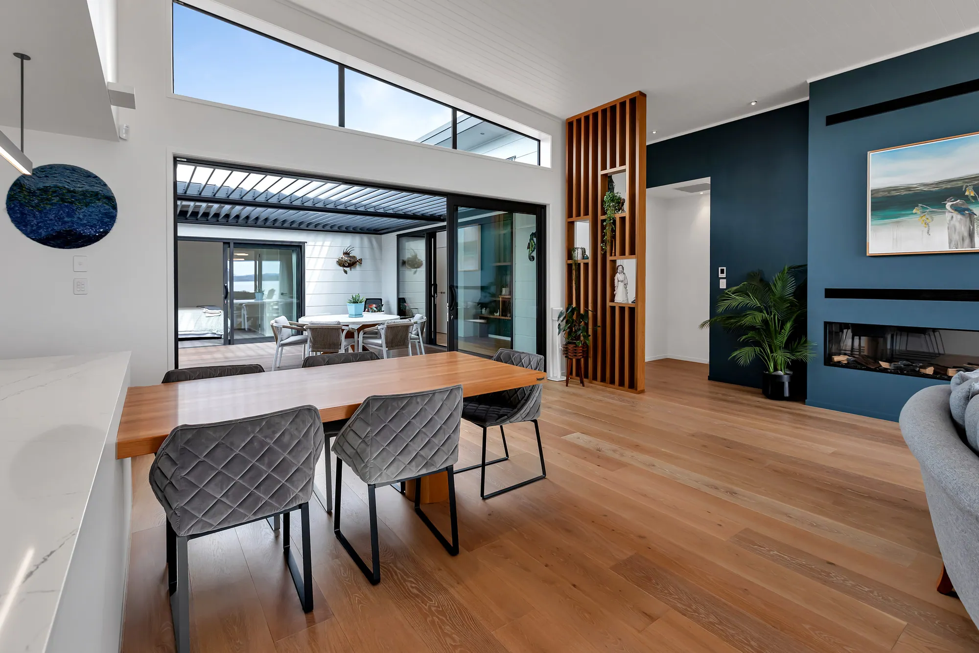 Kitchen and dining opening to a covered outdoor room